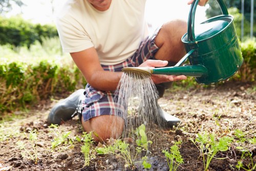 Volunteers collecting garden waste at community compost hub